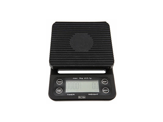 A digital electronic precision scale with a black body and an LCD display, featuring a silicone cover.